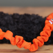 Iver, hundleksak med dubbla expanderhandtag i orange färg.